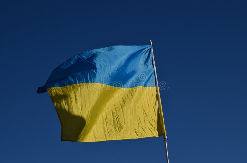 National flag of Ukraine with a clear blue sky