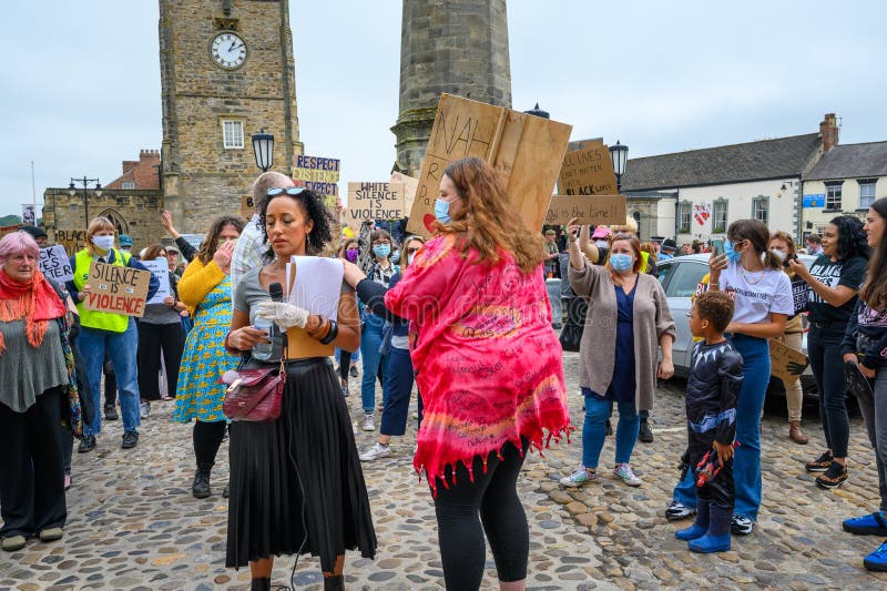 A protester comforts a speaker at an anti-racism, Black Lives Matter protest in the Marketplace in Richmond, North Yorkshire stock photos A protester comforts a speaker at an anti-racism, Black Lives Matter protest in the Marketplace in Richmond, North Yorkshire stock photos