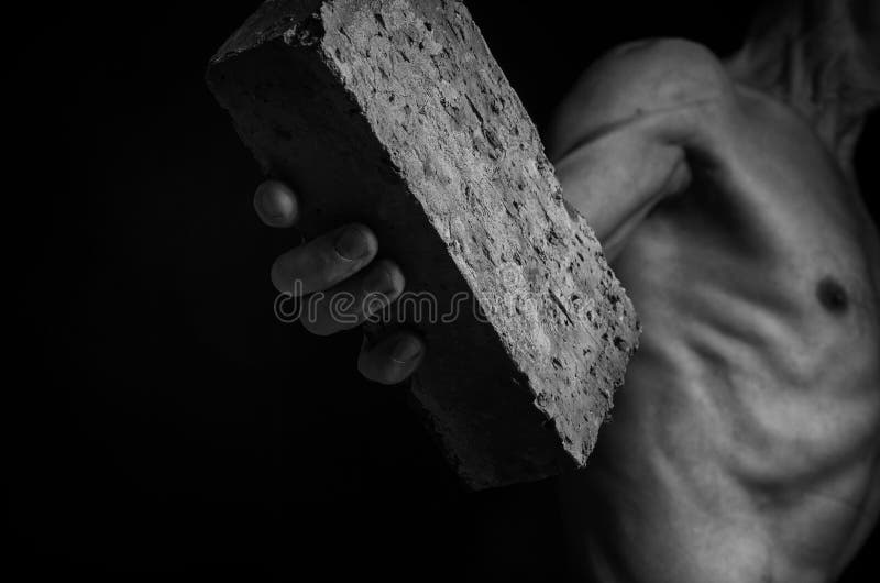 Protesting Man Throws a Brick. Stock Photo Image of protest, throw