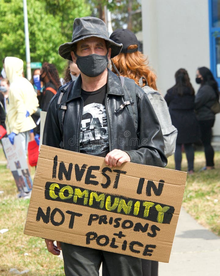 Alameda, CA - June 5, 2020: Protestors participating in  the George Floyd Black Lives Matter protest in Alameda, marching from Encinal High School to City Hall for a rally. Alameda, CA - June 5, 2020: Protestors participating in  the George Floyd Black Lives Matter protest in Alameda, marching from Encinal High School to City Hall for a rally