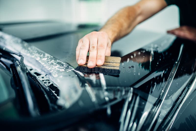 Protezione automatica della pittura, primo piano trasparente del film immagini stock libere da diritti Protezione automatica della pittura, primo piano trasparente del film immagini stock libere da diritti