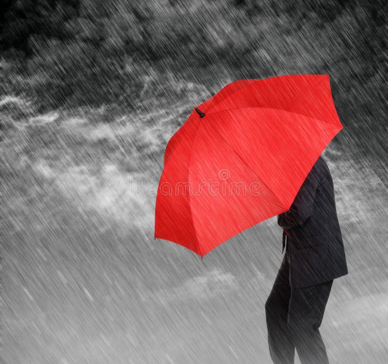 Businessman with red umbrella protecting himself from the storm concept for protection from recession or economic depression etc. Businessman with red umbrella protecting himself from the storm concept for protection from recession or economic depression etc