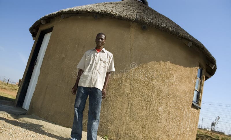 Proud African outside his home