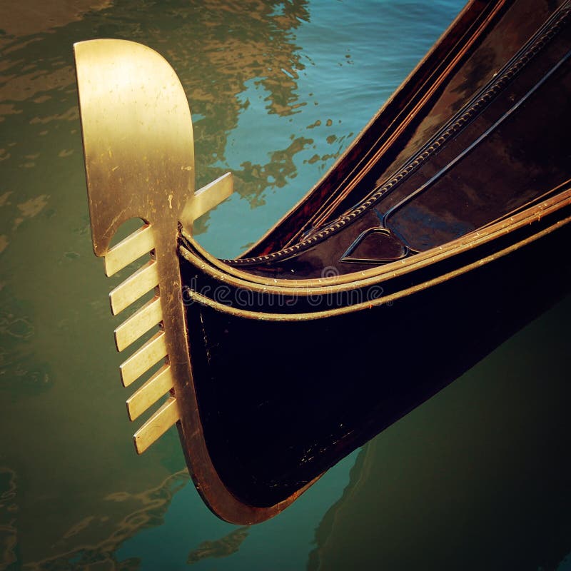 Prow of gondola moored on canal - vintage effect. royalty free stock image Prow of gondola moored on canal - vintage effect. royalty free stock image