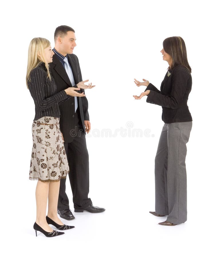 Business people, two women and a man in a discussion with animated hand gestures. Business people, two women and a man in a discussion with animated hand gestures.