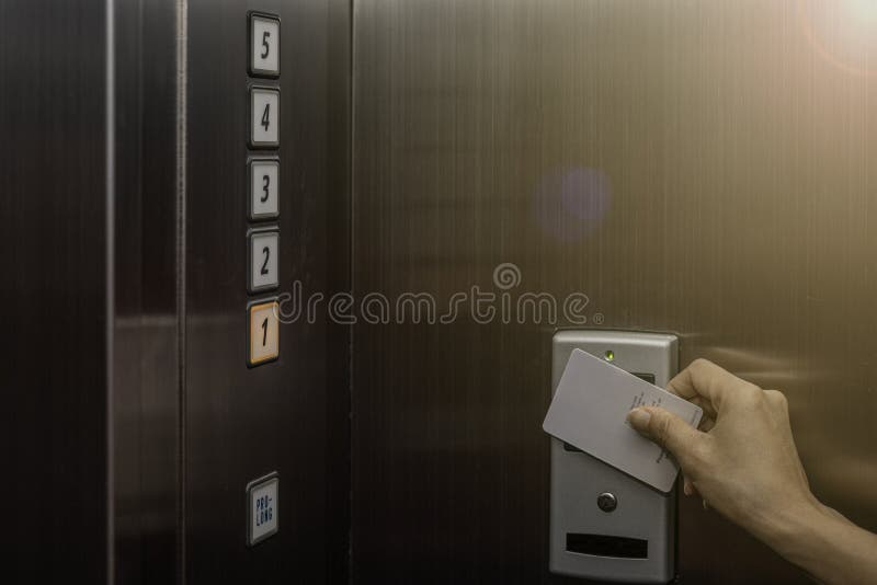 Elevator Access Control, Hand Holding A Key Card To Unlock Elevator