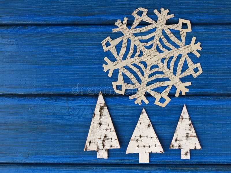 Trees cut off birch bark and paper snowflake. Trees cut off birch bark and paper snowflake