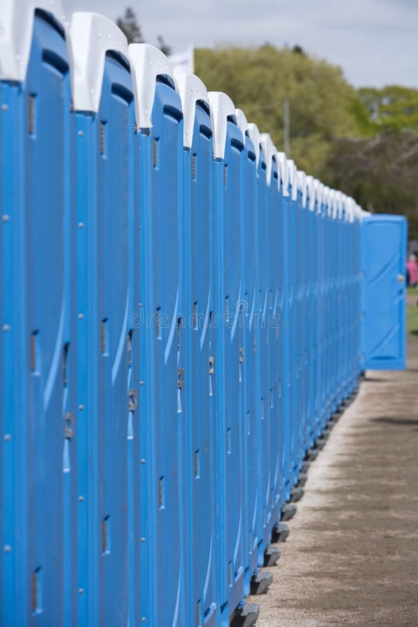 Row of Blue Portable Toilets. Row of Blue Portable Toilets