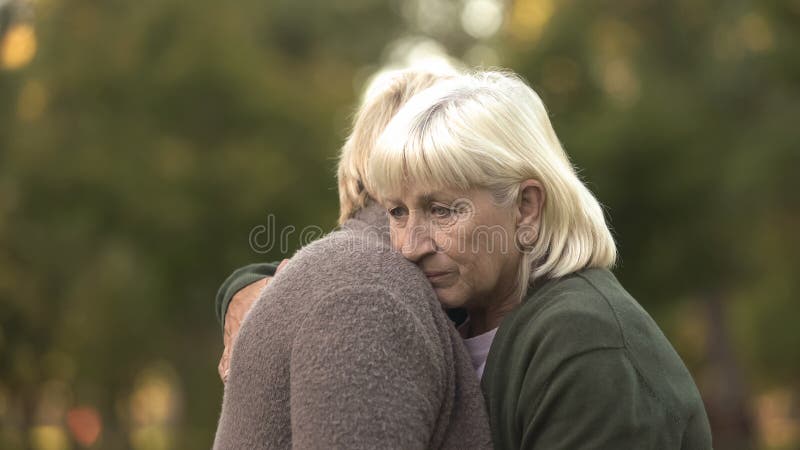 Depressed mature women hugging to support each other, family problems, care, stock photo. Depressed mature women hugging to support each other, family problems, care, stock photo