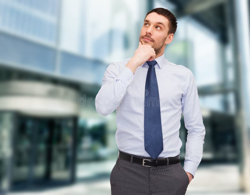 Business and office concept - handsome businessman looking up. Business and office concept - handsome businessman looking up.