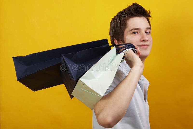 Young happy handsome man with presents. Young happy handsome man with presents