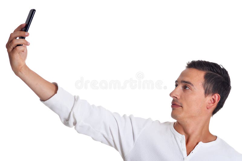 Przystojny młody człowiek w białym ubraniowym bierze selfie z smartphone pozuje na białym tle obrazy royalty free Przystojny młody człowiek w białym ubraniowym bierze selfie z smartphone pozuje na białym tle obrazy royalty free