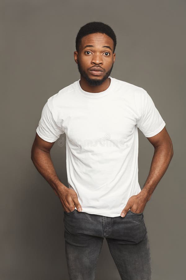 Handsome young black man portrait in casual at grey studio background, crop. Handsome young black man portrait in casual at grey studio background, crop