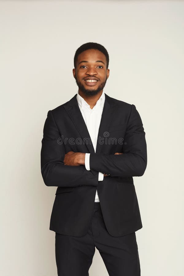 Happy smiling young black man portrait in formal wear at white studio background, crop. Happy smiling young black man portrait in formal wear at white studio background, crop