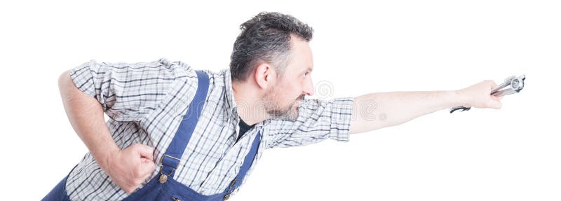 Przystojny repairman z wyrwaniem w latającej pozyci działaniu lubi su fotografia royalty free Przystojny repairman z wyrwaniem w latającej pozyci działaniu lubi su fotografia royalty free