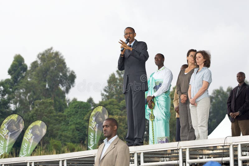The President of Rwanda Paul Kagame and the american actor Don Cheadle, behind him, performed the opening speach at the Kwita Izina ceremony, June 5th 2010, Kinigi, Rwanda: the ceremony of giving a name to a new born baby commonly known as â€œKwita Izinaâ€ has been part of the Rwandan tradition for centuries. This ceremony has also been used for past 3 decades now to give names to new born gorillas. The names attributed to the gorillas play a great part in the program of monitoring of each individual and gorilla groups in its habitat. The President of Rwanda Paul Kagame and the american actor Don Cheadle, behind him, performed the opening speach at the Kwita Izina ceremony, June 5th 2010, Kinigi, Rwanda: the ceremony of giving a name to a new born baby commonly known as â€œKwita Izinaâ€ has been part of the Rwandan tradition for centuries. This ceremony has also been used for past 3 decades now to give names to new born gorillas. The names attributed to the gorillas play a great part in the program of monitoring of each individual and gorilla groups in its habitat.