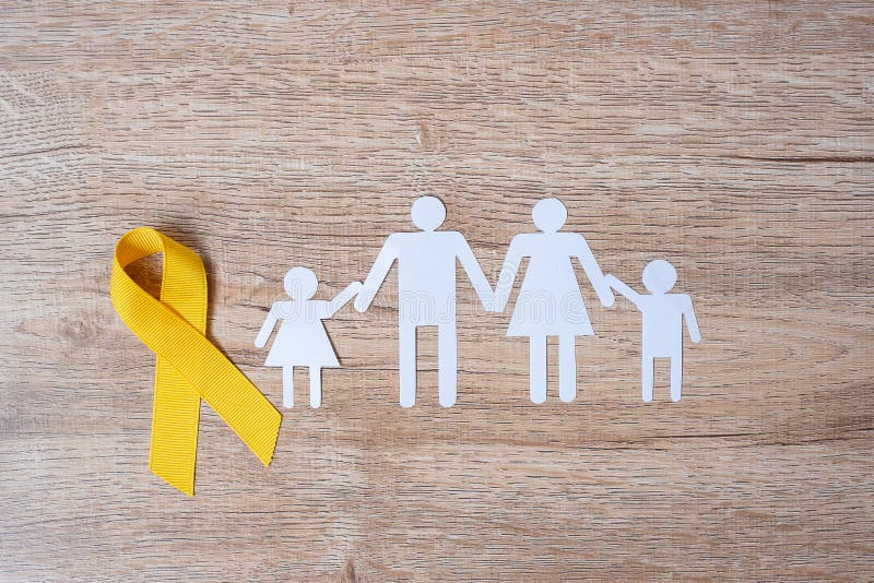 Suicide prevention and Childhood Cancer Awareness, Yellow Ribbon and family paper shape for supporting people living and illness. children Healthcare and World cancer day concept. Suicide prevention and Childhood Cancer Awareness, Yellow Ribbon and family paper shape for supporting people living and illness. children Healthcare and World cancer day concept