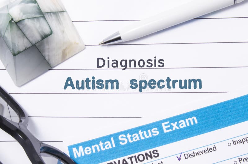 Psychiatric Diagnosis Autism Spectrum. Medical book or form with the name of diagnosis Autism Spectrum is on table of doctor surro