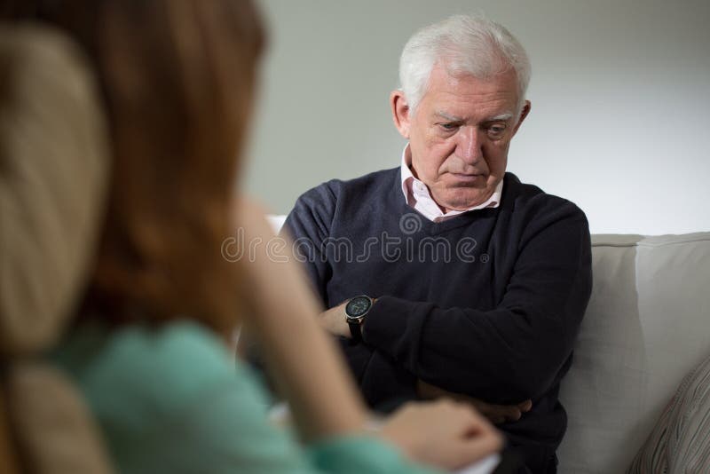 Psychologist listening about problems of senior man. Psychologist listening about problems of senior man