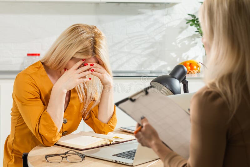 Psychologist Comforting A Depressed Woman During A Mental Therapy