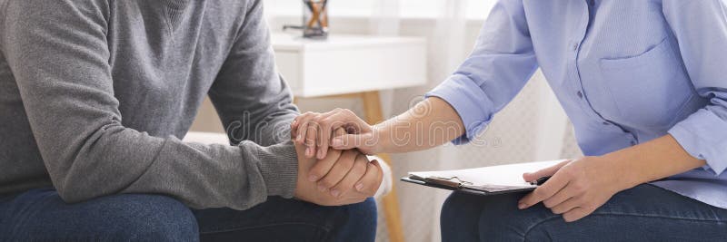 Psychotherapist supporting her depressed patient close up