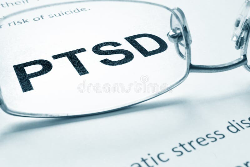 PTSD. Sign on a paper and glasses stock image