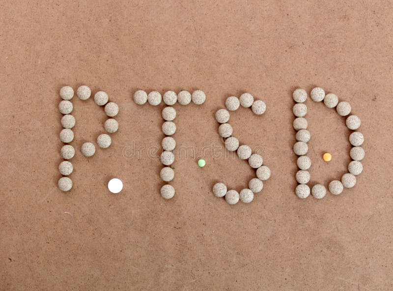 PTSD text with herbal pills on a wood background royalty free stock photos PTSD text with herbal pills on a wood background royalty free stock photos