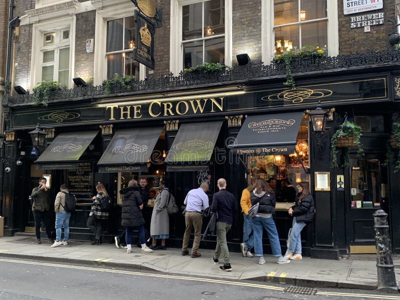 Historical London public house Pub in London, England with clients outside enjoying a pint