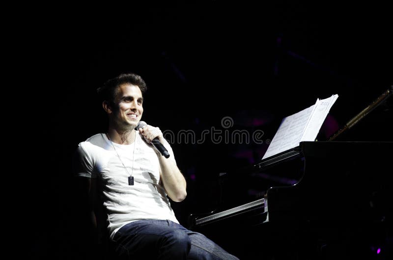 MANAMA, BAHRAIN - APRIL 4: Piano Pop Zade Dirani with Orchestra performs on APRIL 4, 2013, during the Pearls of Bahrain celebration at Bahrain National Theatre, Manama, Bahrain. MANAMA, BAHRAIN - APRIL 4: Piano Pop Zade Dirani with Orchestra performs on APRIL 4, 2013, during the Pearls of Bahrain celebration at Bahrain National Theatre, Manama, Bahrain