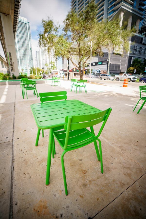 Public Green Tables and Chairs at the Brickell Underline Miami Stock