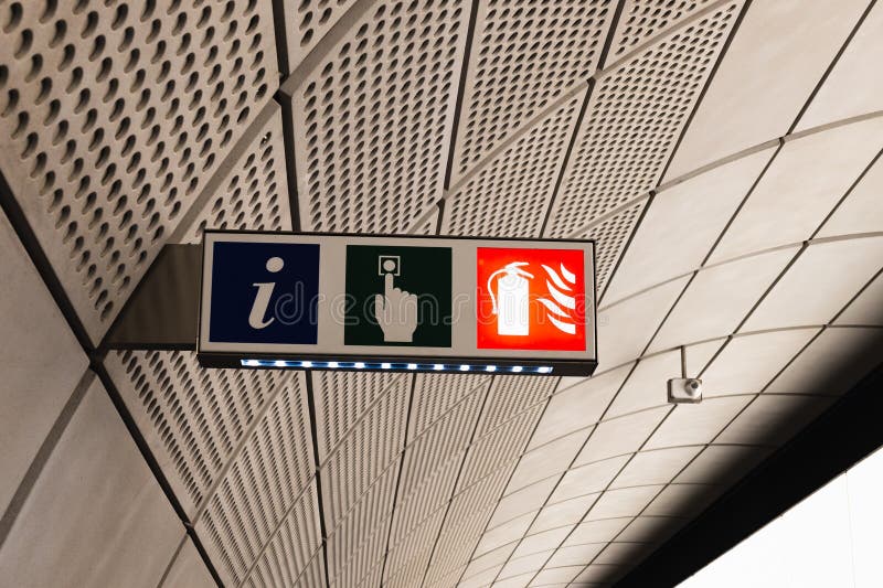 Public signage with information, exit, and WC icons, highlighting a directional indicator for wayfinding. Exit signage stock images, royalty-free photos and pictures