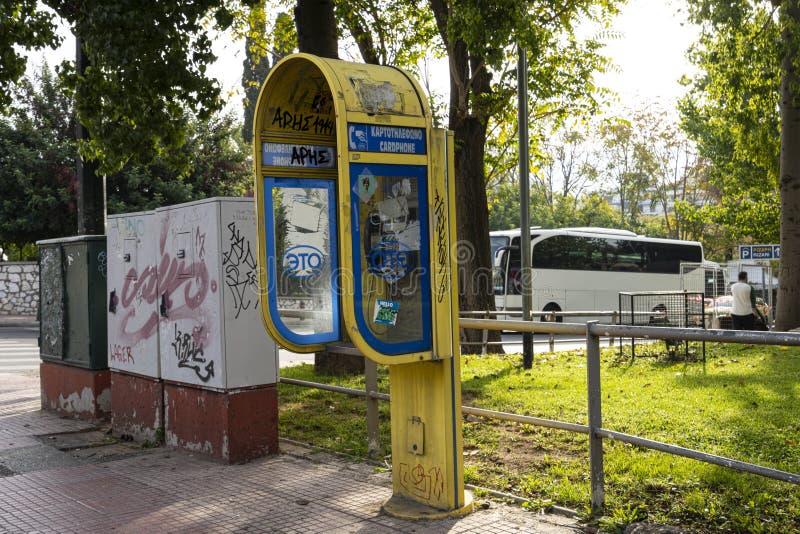 Yellow glass telephone booths with payphones are located on a pedestrian  street. Obsolete means of telephone communication in free access. Bialystok  Stock Photo - Alamy