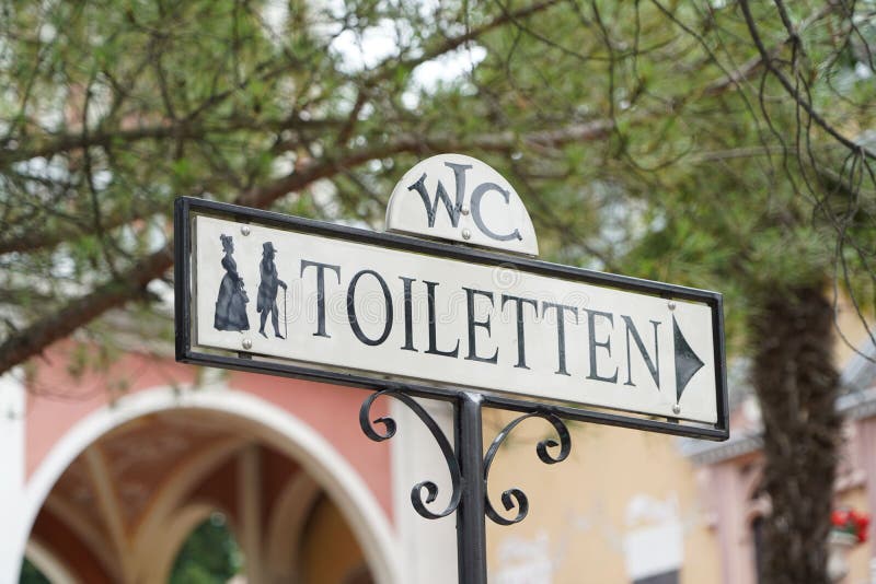 Public toilet sign on the street stock photo