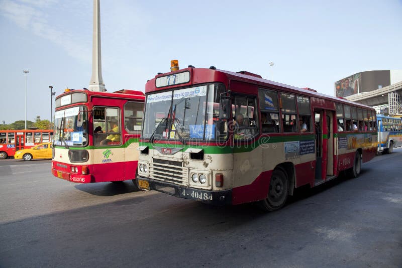 BANGKOK, THAILAND - JAN 3 : Public transport bus stop at Victory monument with skytrain track on background on Jan 3,2015.