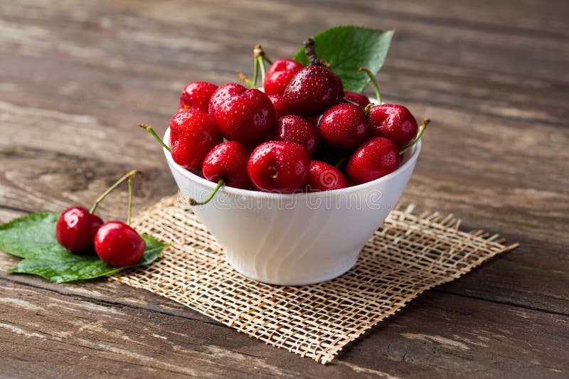 Bowl with red cherries, freshly picked cherries concept. Bowl with red cherries, freshly picked cherries concept