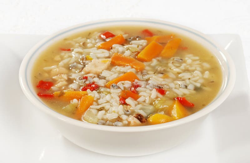 Closeup of a bowl of chicken and wild rice soup with vegetables. Closeup of a bowl of chicken and wild rice soup with vegetables