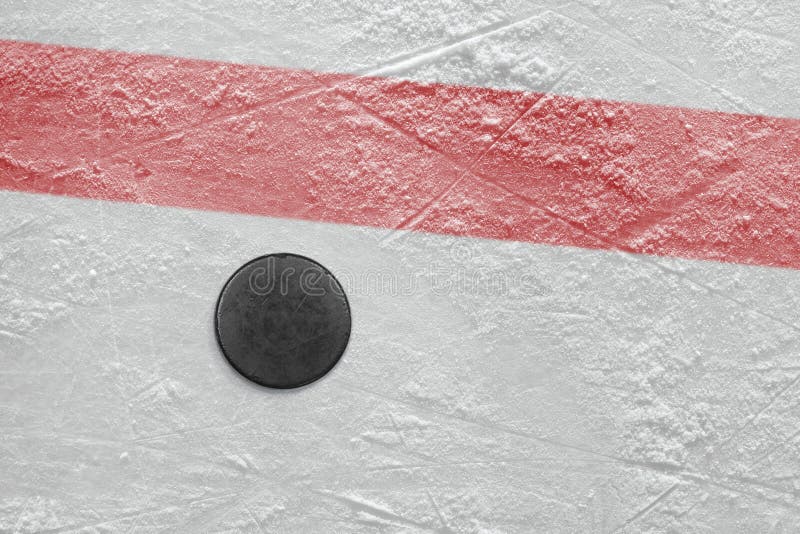 Puck on a hockey rink stock image Puck on a hockey rink stock image