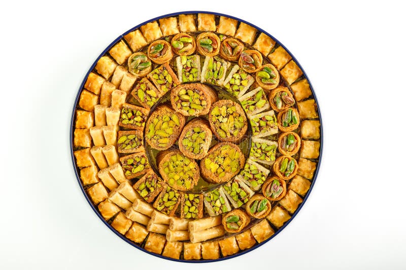 Arabic sweets boxes. Pictured from above showing several shapes and types of sweets with sesame, pistachios, dates and walnuts. Arabic sweets boxes. Pictured from above showing several shapes and types of sweets with sesame, pistachios, dates and walnuts