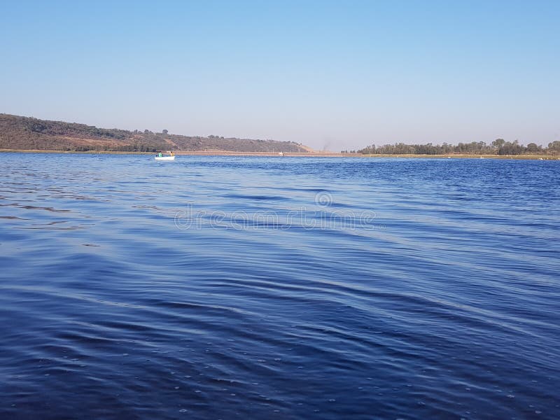 Puente Calderon Dam in Jalisco, waves in the blue water