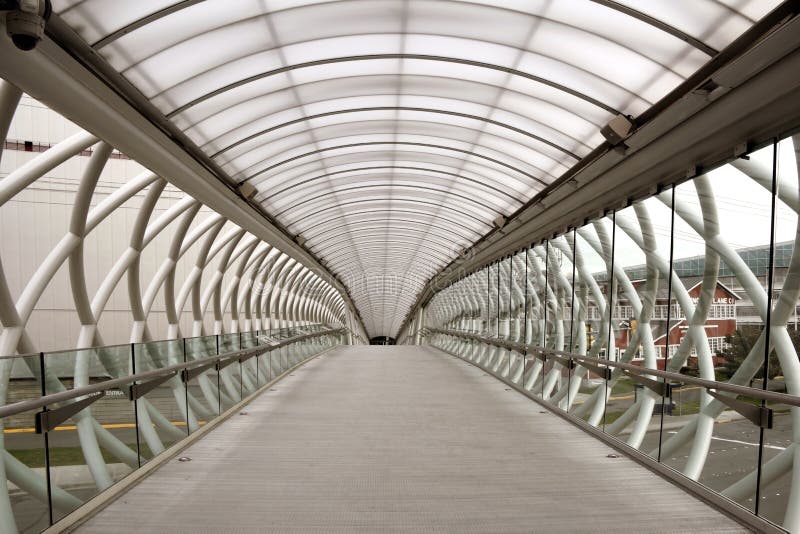 A sky bridge made out of aluminum, plastic and glass, is for the pedestrians to cross over traffic underneath, located in Seattle, Washington, USA. A sky bridge made out of aluminum, plastic and glass, is for the pedestrians to cross over traffic underneath, located in Seattle, Washington, USA