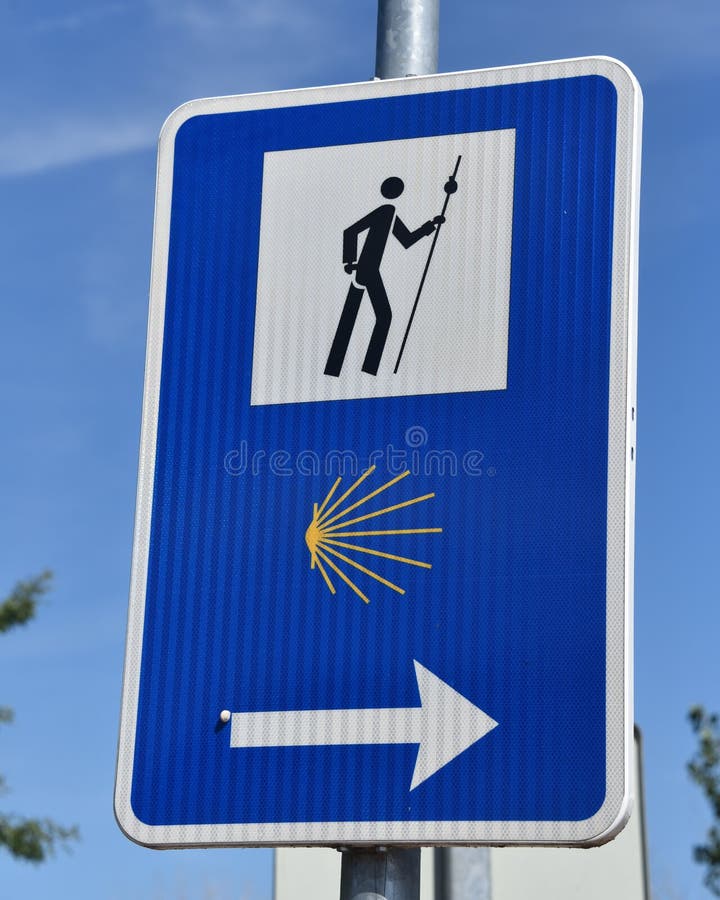 Puente la Reina, Spain - 31 Aug, 2022: Signpost marking directions for pligrims on the El Camino de Santiago footpath royalty free stock image