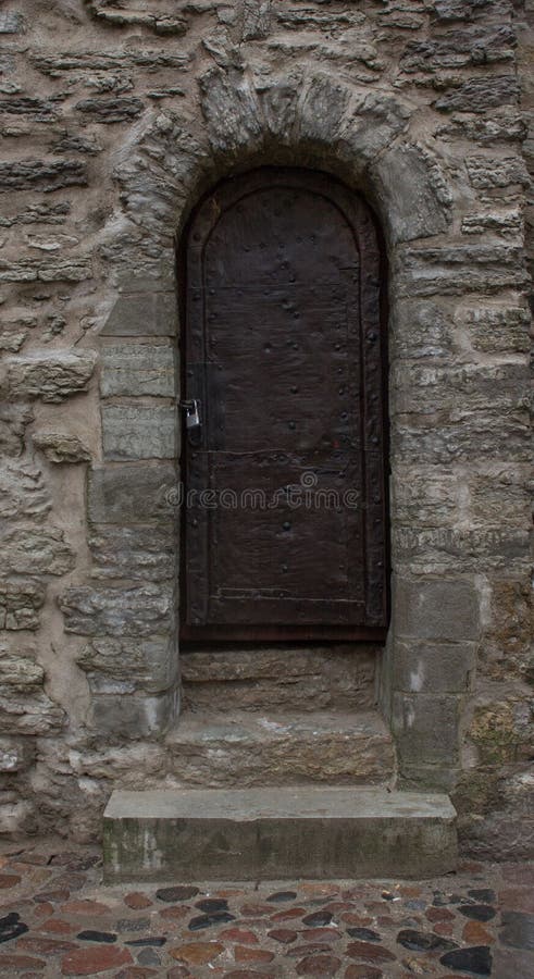 Vintage wooden door. Historic castle. Tallinn. Estonia. Of the historic centre. Old town. Vintage wooden door. Historic castle. Tallinn. Estonia. Of the historic centre. Old town.