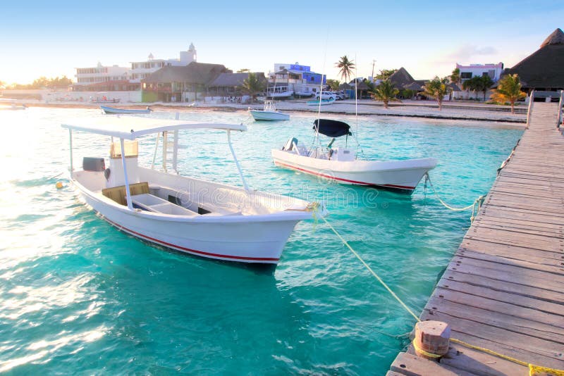 Puerto Morelos beach boats pier Mayan Riviera