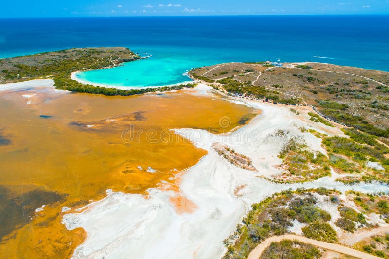 Aerial view of Puerto Rico. Faro Los Morrillos de Cabo Rojo. Playa Sucia beach and Salt lakes in Punta Jaguey.