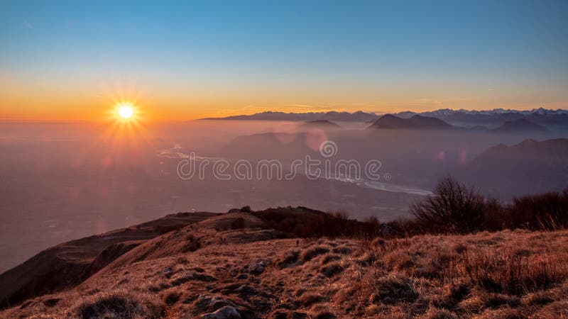 Sunset at the Cuarnan peak, Friuli-Venezia Giulia Region, in a freezing winter day. Sunset at the Cuarnan peak, Friuli-Venezia Giulia Region, in a freezing winter day