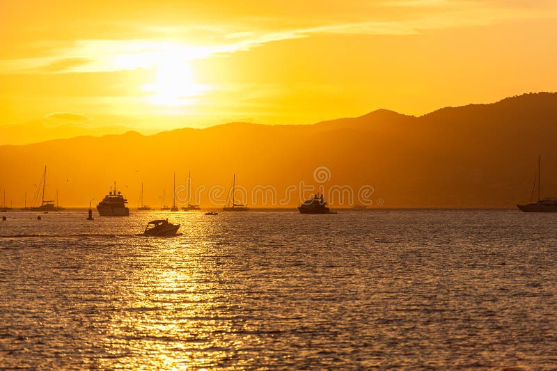 A sunset over the Mediterranean Sea in Cannes, France. A sunset over the Mediterranean Sea in Cannes, France.