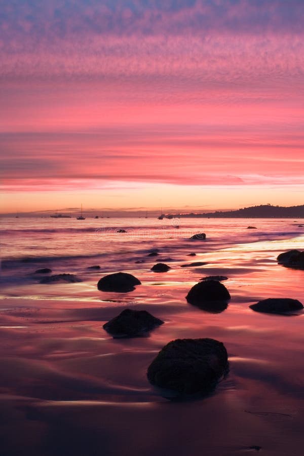 A sunset during low tide along Butterfly Beach in Santa Barbara, CA. A sunset during low tide along Butterfly Beach in Santa Barbara, CA.