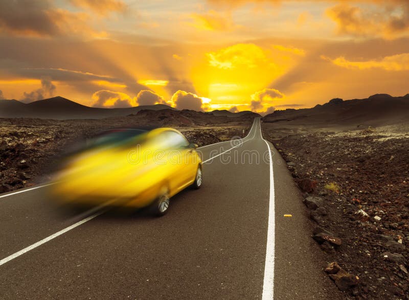 Yellow sunset over fast car and asphalt road, Canary island Lanzarote. Yellow sunset over fast car and asphalt road, Canary island Lanzarote