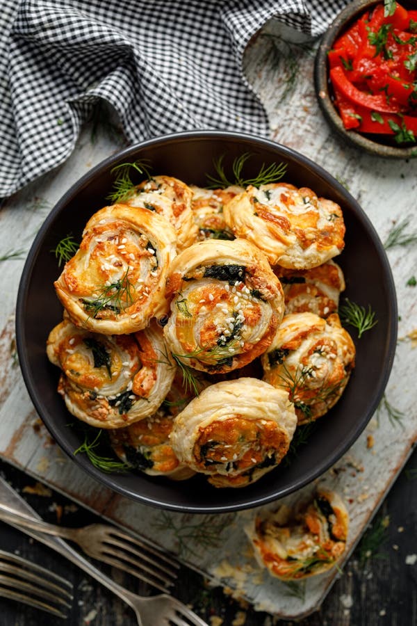 Puff Pastry Pinwheels Stuffed with Salmon, Cheese and Spinach in a Bowl