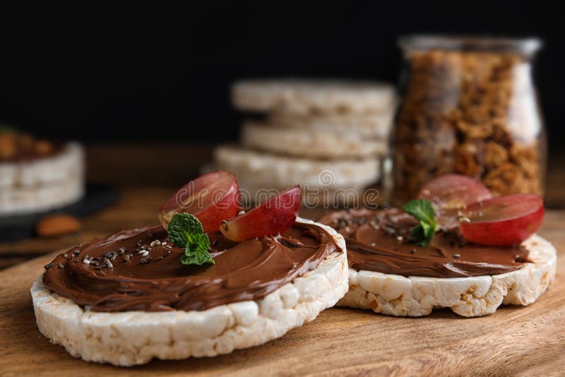 Puffed Rice Cakes with Chocolate Spread and Grape on Board, Closeup